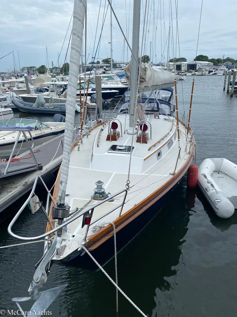 Slide: The Image of 1988 Bristol 41.1 Aft Cockpit sailboat docked at a marina with inflatable dinghy. - 9