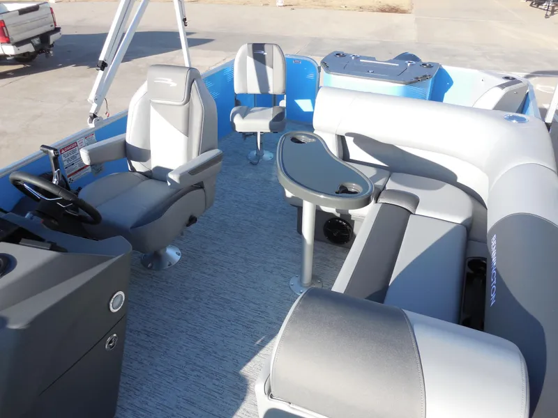 Slide: The Image of 2025 Bennington 188 SF pontoon boat interior with gray seating and steering console. - 6