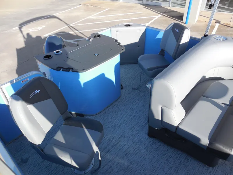 Slide: The Image of 2025 Bennington 188 SF boat interior with gray seating and blue accents. - 8