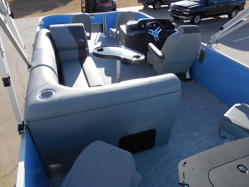 Slide: The Image of 2025 Bennington 188 SF pontoon boat interior with gray seating and steering console. - 9