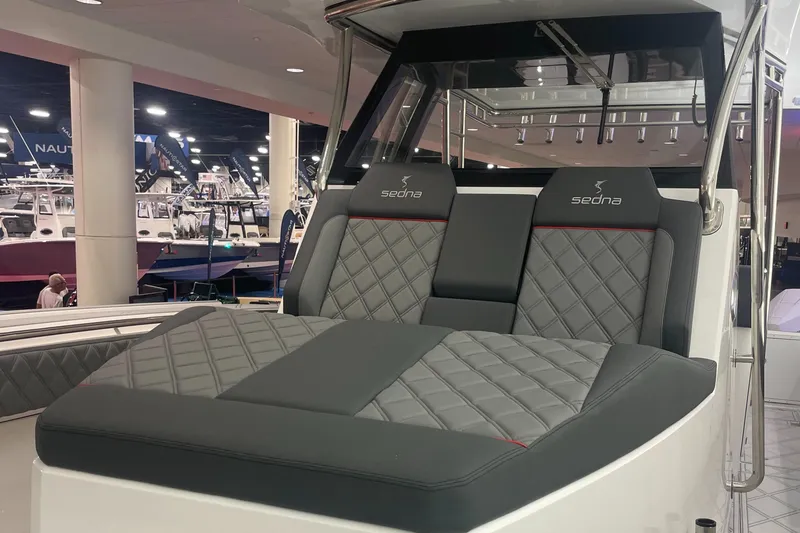 Slide: The Image of 2024 Sedna 370 Open boat with luxurious quilted seating at a boat show. - 9