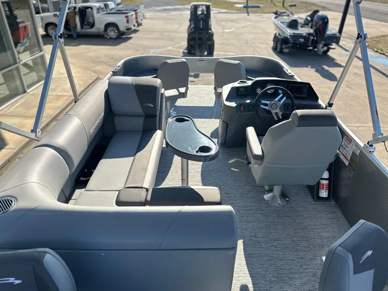 Slide: The Image of 2025 Bennington 188 SF pontoon boat interior with seating and steering console. - 4