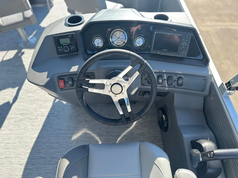 Slide: The Image of 2025 Bennington 188 SF boat dashboard with steering wheel and instrument panel. - 5