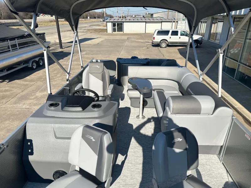 Slide: The Image of 2025 Bennington 188 SF pontoon boat interior with seating and helm. - 7