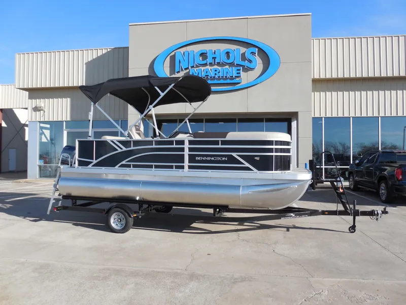 Slide: The Image of 2025 Bennington 188 SL pontoon boat at Nichols Marine dealership. - 1