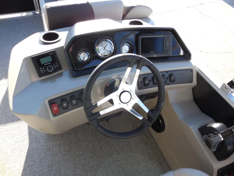 Slide: The Image of 2025 Bennington 188 SL boat dashboard with steering wheel and control panel. - 7
