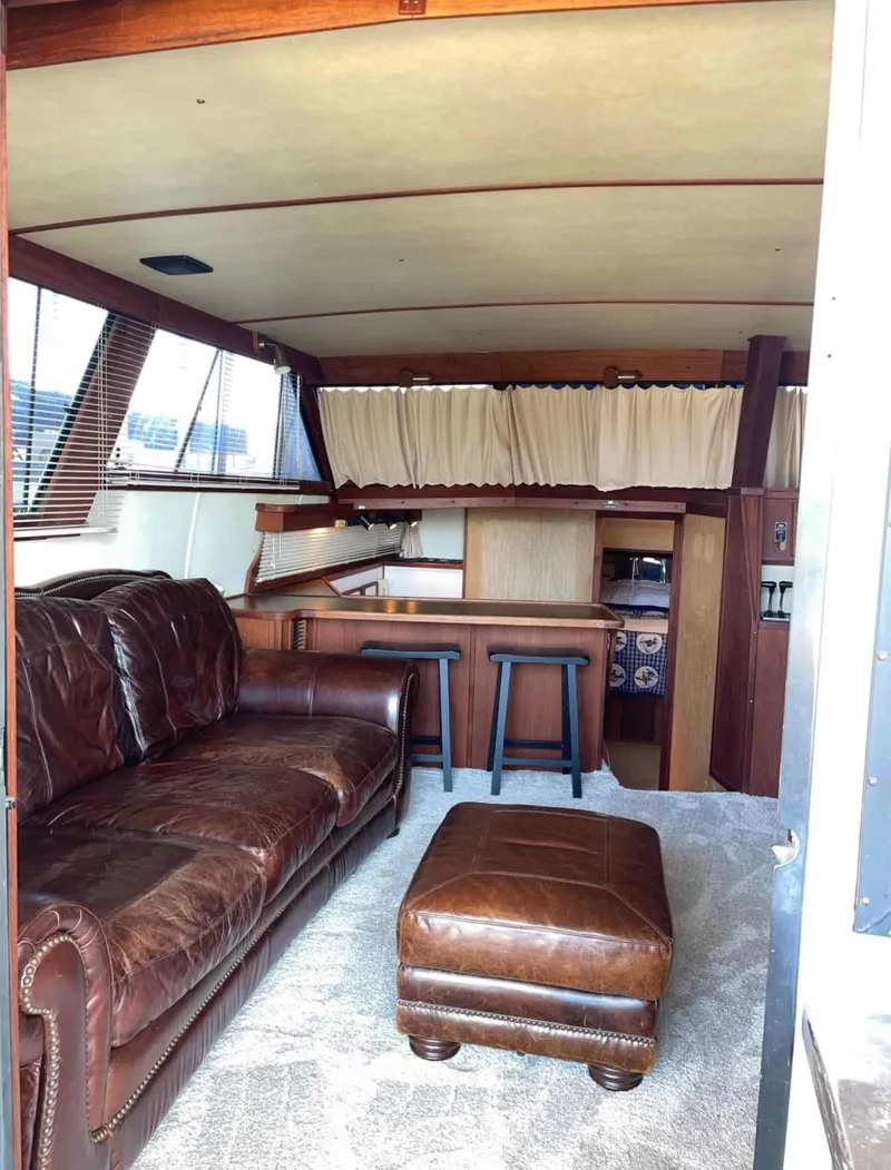 Slide: The Image of Interior of 1989 Marinette 41 Marquis Convertible with leather seating and wooden accents. - 10