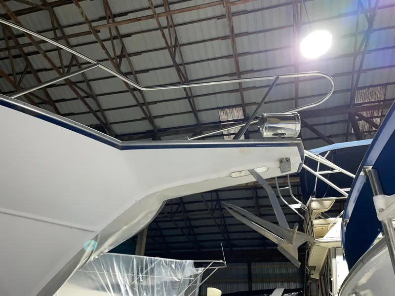 Slide: The Image of 1989 Marinette 41 Marquis Convertible boat in a storage facility. - 5