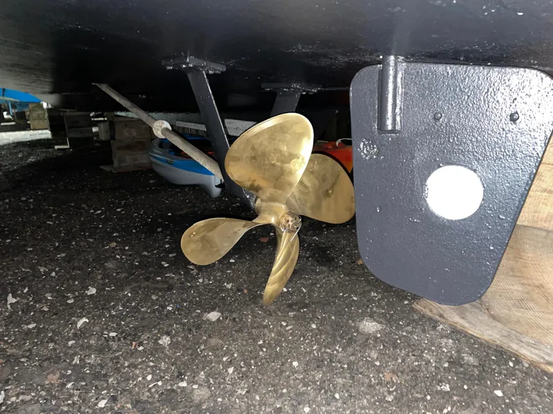 Slide: The Image of Propeller of 1989 Marinette 41 Marquis Convertible boat on dry dock. - 6