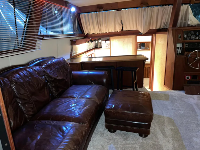 Slide: The Image of Luxurious interior of 1989 Marinette 41 Marquis Convertible yacht with leather seating. - 9