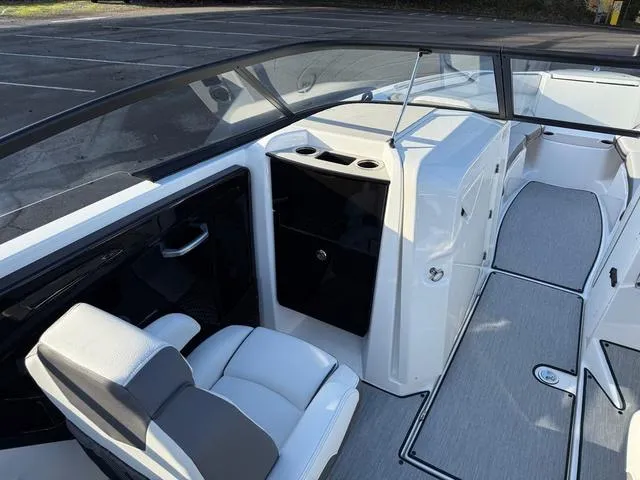 Slide: The Image of 2025 Yamaha Boats AR250 interior with sleek seating and modern dashboard design. - 10