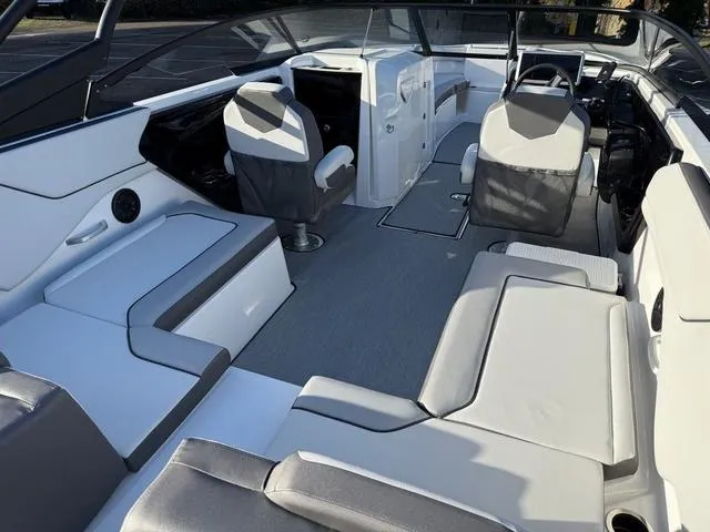Slide: The Image of 2025 Yamaha Boats AR250 interior with modern seating and sleek design. - 14