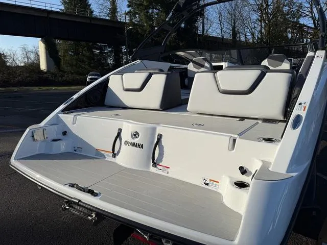 Slide: The Image of 2025 Yamaha Boats AR250, rear view, showcasing seating and deck design. - 3