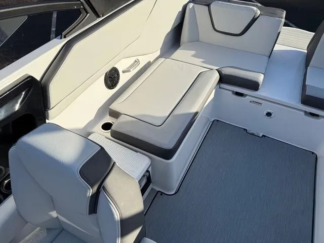 Slide: The Image of 2025 Yamaha Boats AR250 interior seating with modern design and comfortable upholstery. - 6