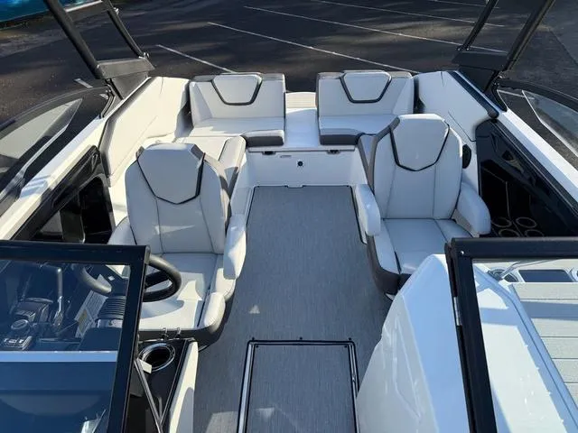 Slide: The Image of 2025 Yamaha Boats AR250 interior with modern seating and sleek design. - 8