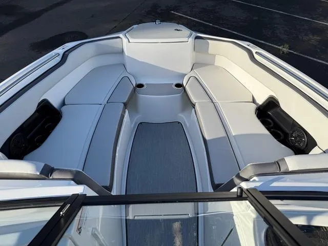 Slide: The Image of 2025 Yamaha Boats AR250 interior with spacious seating and modern design. - 9