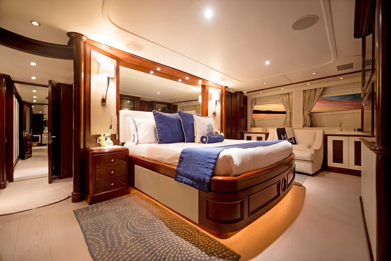 Slide: The Image of Luxurious bedroom interior of 2003 Benetti 115 Classic yacht with elegant furnishings and ambient lighting. - 13