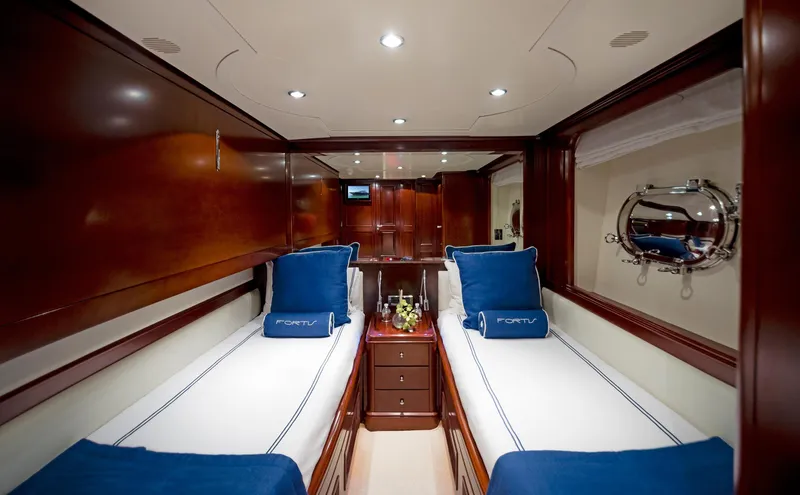Slide: The Image of Luxurious twin cabin on 2003 Benetti 115 Classic yacht with elegant wood finish. - 15