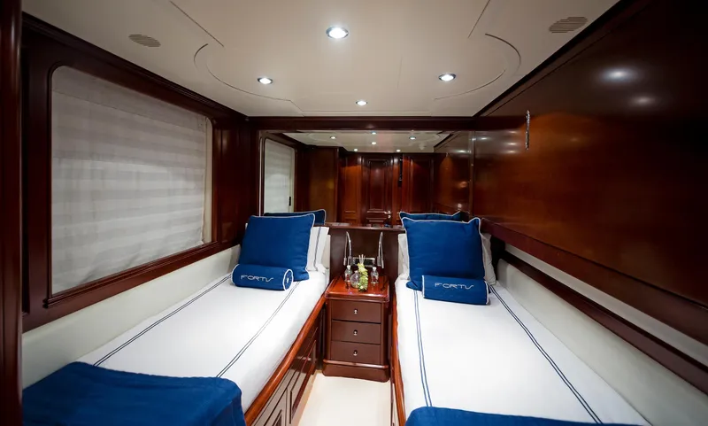 Slide: The Image of Luxurious twin cabin on 2003 Benetti 115 Classic yacht with elegant wood finish. - 16