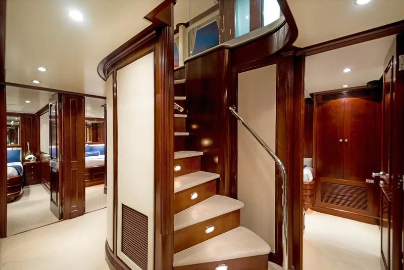 Slide: The Image of Luxurious interior of 2003 Benetti 115 Classic yacht with elegant wooden staircase. - 20