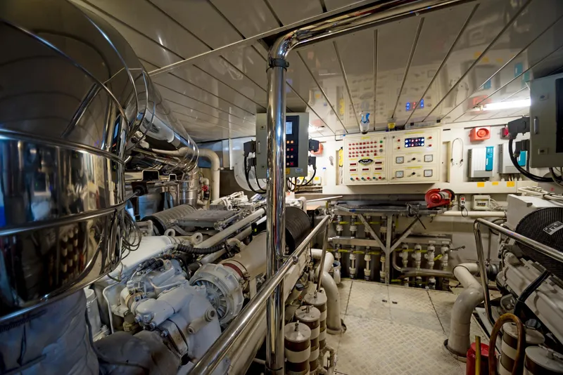 Slide: The Image of Engine room of 2003 Benetti 115 Classic yacht, featuring control panels and machinery. - 21
