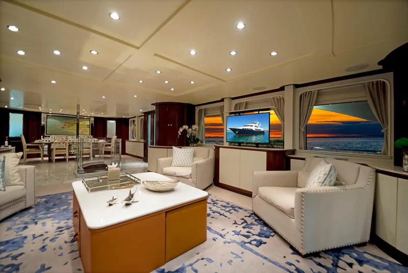 Slide: The Image of Luxurious interior of a 2003 Benetti 115 Classic yacht with elegant seating and ocean views. - 8