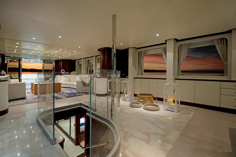 Slide: The Image of Luxurious interior of 2003 Benetti 115 Classic yacht with elegant decor and sunset views. - 9