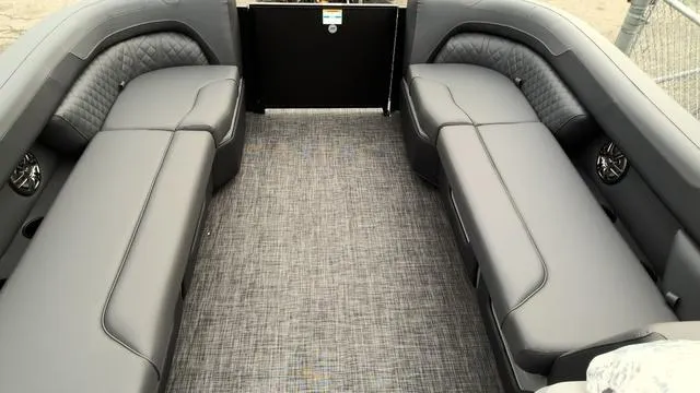 Slide: The Image of 2025 Godfrey Pontoons Sweetwater 2286 SB interior with gray seating and storage. - 10