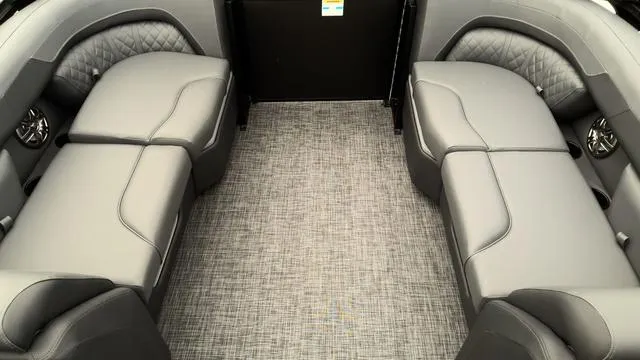 Slide: The Image of 2025 Godfrey Pontoons Sweetwater 2286 SB interior with gray seating and carpeted floor. - 15