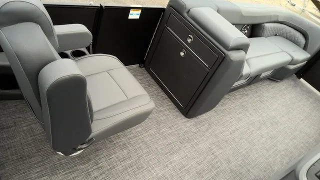 Slide: The Image of 2025 Godfrey Pontoons Sweetwater 2286 SB interior with gray seating and storage. - 16