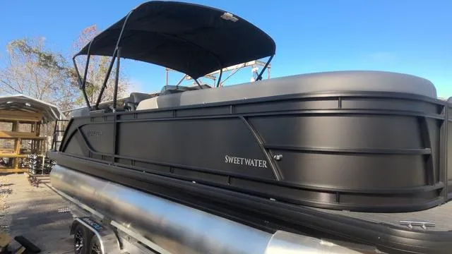 Slide: The Image of 2025 Godfrey Pontoons Sweetwater 2286 SB GTP, spacious deck view, modern design. - 2