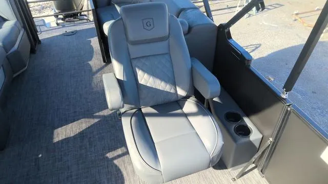 Slide: The Image of Luxury seating on 2025 Godfrey Pontoons Sweetwater 2286 SB, featuring armrests and cup holders. - 20