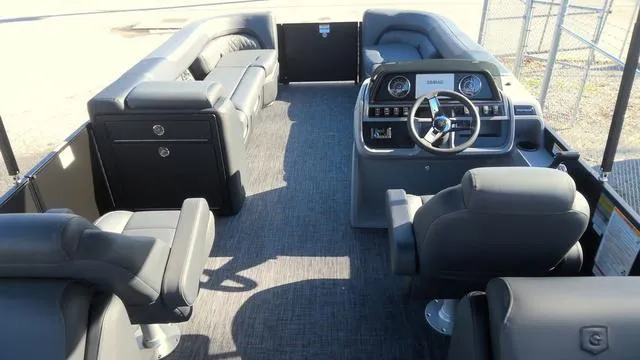 Slide: The Image of 2025 Godfrey Pontoons Sweetwater 2286 SB GTP interior with luxurious seating and modern helm. - 25