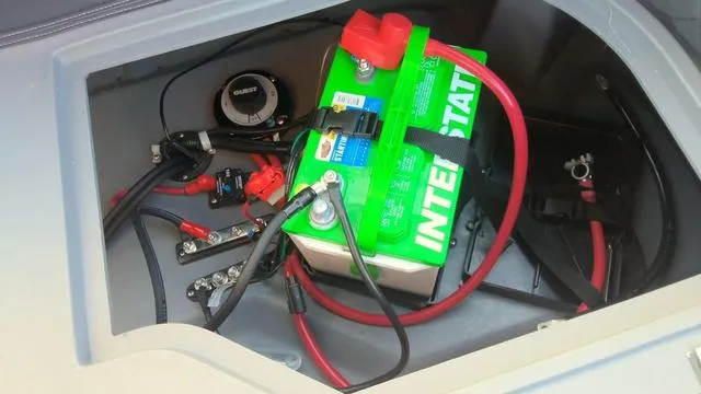 Slide: The Image of Battery compartment of 2025 Godfrey Pontoons Sweetwater 2286 SB GTP, featuring Interstate battery. - 27