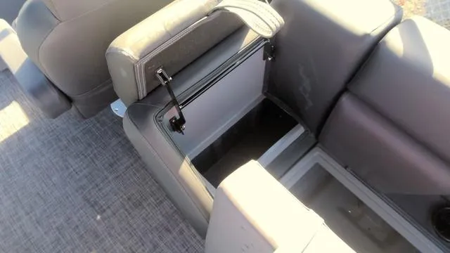 Slide: The Image of Open storage compartment in 2025 Godfrey Pontoons Sweetwater 2286 SB GTP boat seat. - 29