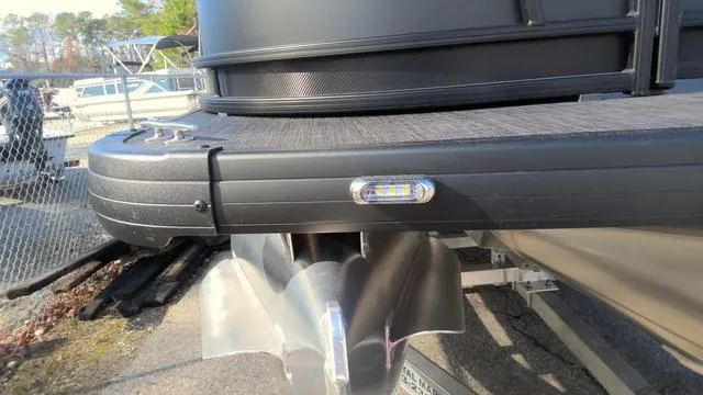 Slide: The Image of 2025 Godfrey Pontoons Sweetwater 2286 SB GTP, close-up of center tube and propeller. - 31