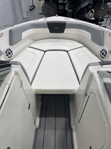 Slide: The Image of 2022 Chaparral 23 SSi boat interior with sleek, modern seating design. - 12