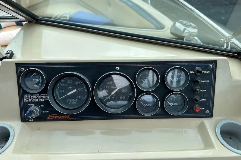Slide: The Image of 1987 Seaswirl Sierra II dashboard with gauges and controls, featuring RPM, speed, and fuel indicators. - 13