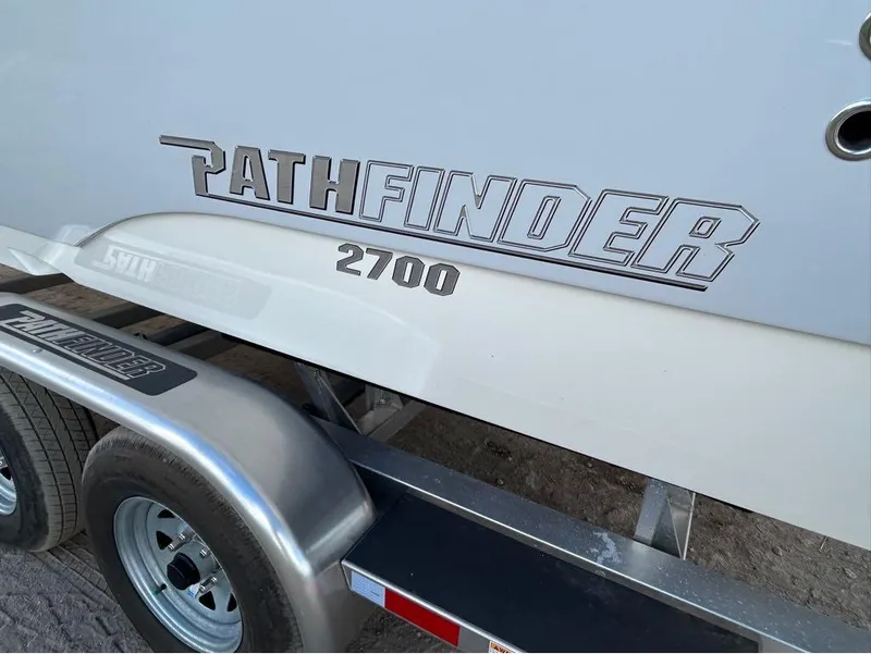 Slide: The Image of 2025 Pathfinder 2700 Open boat on trailer, close-up view. - 11