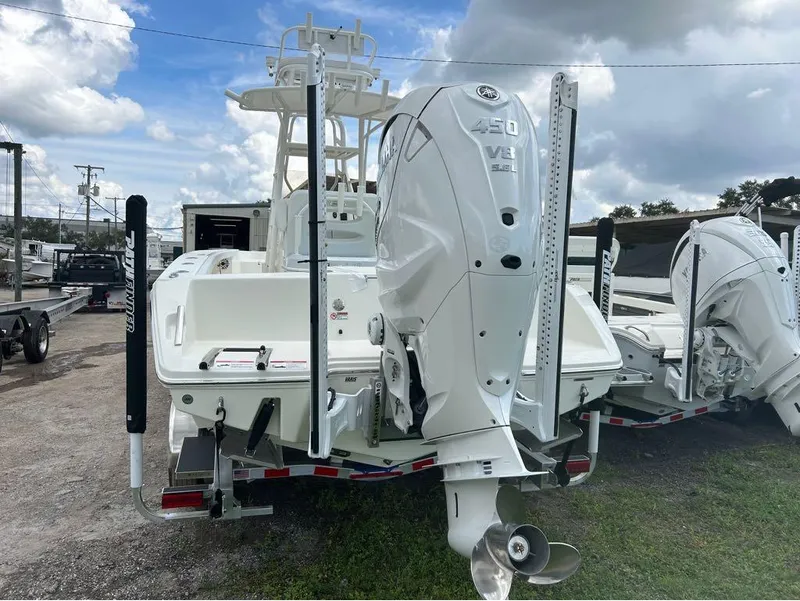 Slide: The Image of 2025 Pathfinder 2700 Open boat with powerful 450 V8 engine, parked outdoors. - 12