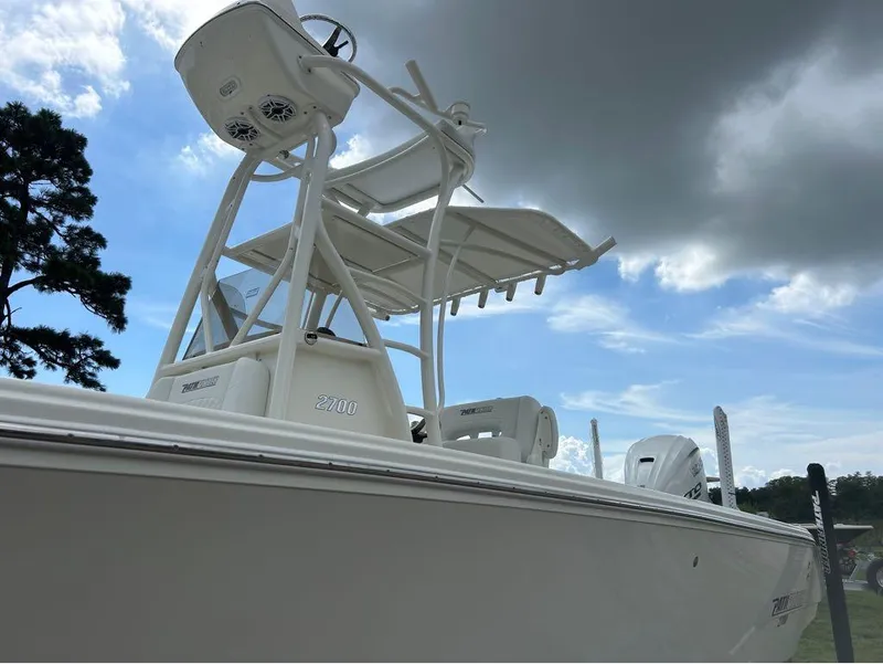 Slide: The Image of 2025 Pathfinder 2700 Open boat under cloudy sky, side view. - 14