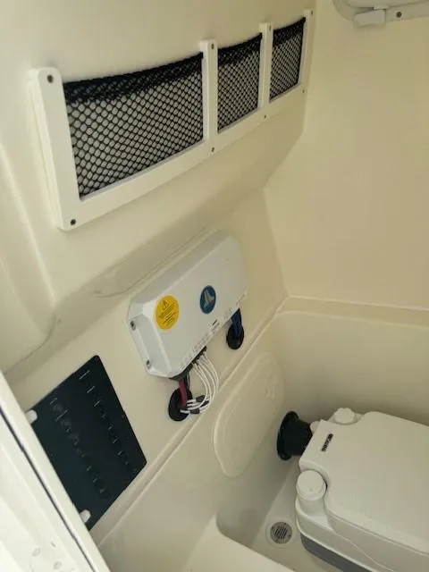 Slide: The Image of Interior of 2025 Pathfinder 2700 Open boat with storage and electrical panel. - 3