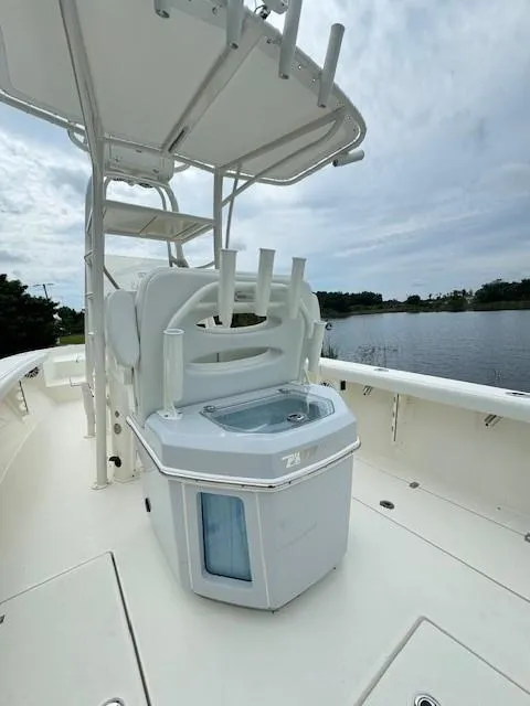 Slide: The Image of 2025 Pathfinder 2700 Open boat interior with fishing rod holders and storage. - 8