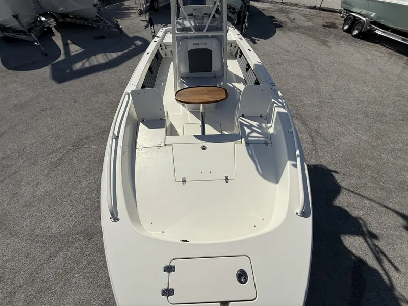 Slide: The Image of 2025 Pathfinder 2600 TRS boat deck, featuring seating and storage compartments. - 11