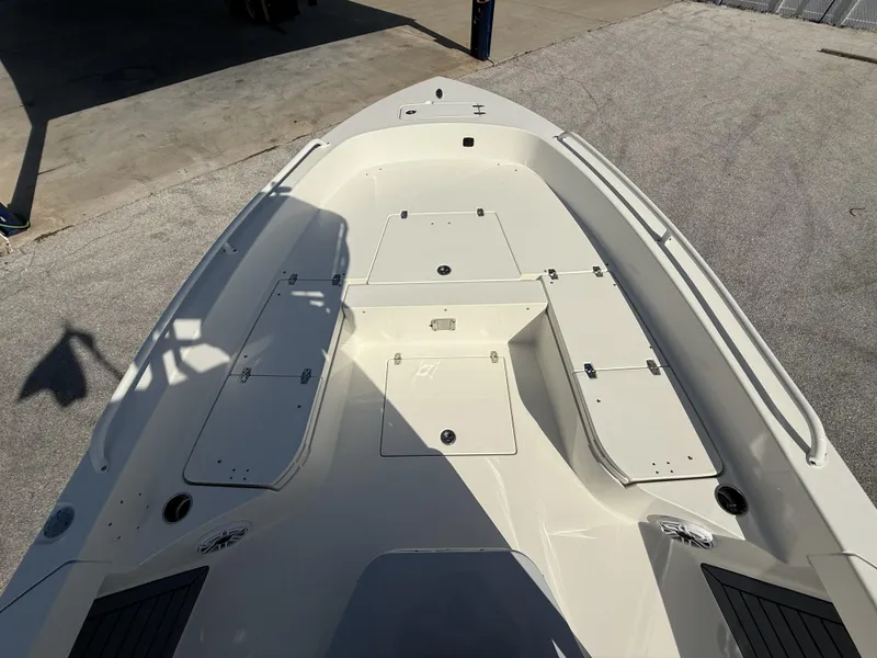 Slide: The Image of 2025 Pathfinder 2600 TRS boat deck, featuring storage compartments and sleek design. - 13