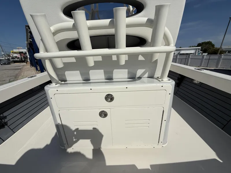 Slide: The Image of 2025 Pathfinder 2600 TRS boat console with rod holders and storage compartments. - 16