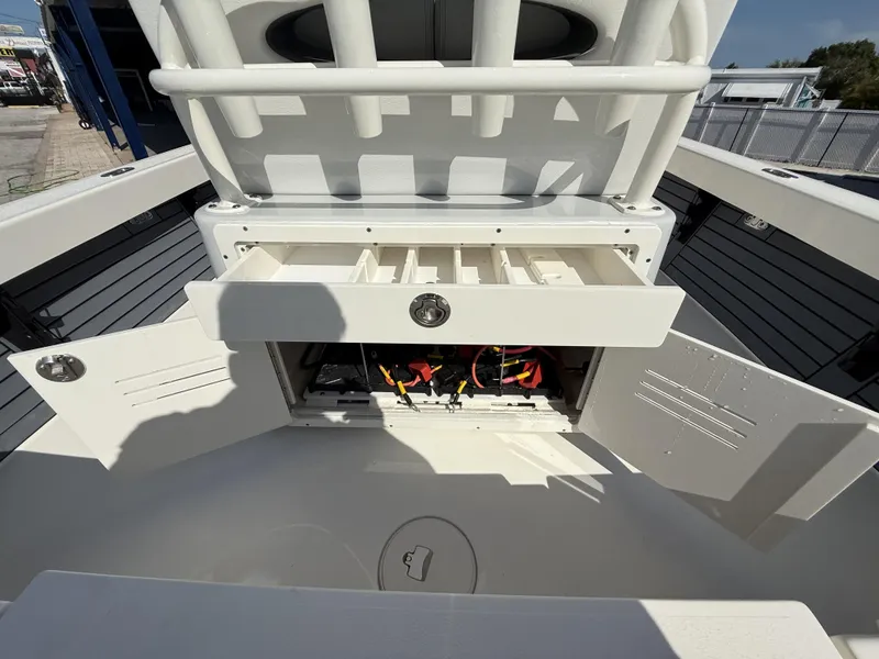 Slide: The Image of 2025 Pathfinder 2600 TRS boat storage compartments open, showcasing interior organization. - 17