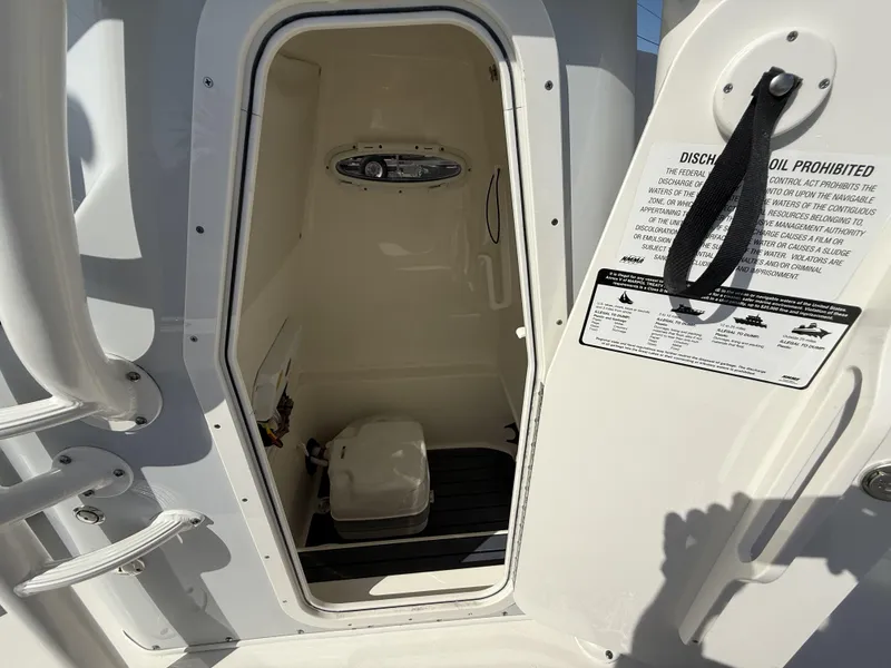Slide: The Image of 2025 Pathfinder 2600 TRS boat interior with storage compartment and safety instructions. - 22