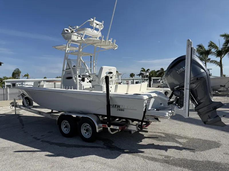 Slide: The Image of 2025 Pathfinder 2600 TRS boat on trailer, featuring Yamaha outboard motor, parked outdoors. - 3