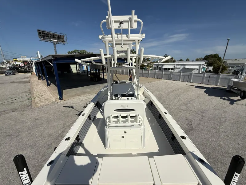 Slide: The Image of 2025 Pathfinder 2600 TRS boat, docked in a sunny marina, showcasing spacious deck layout. - 30